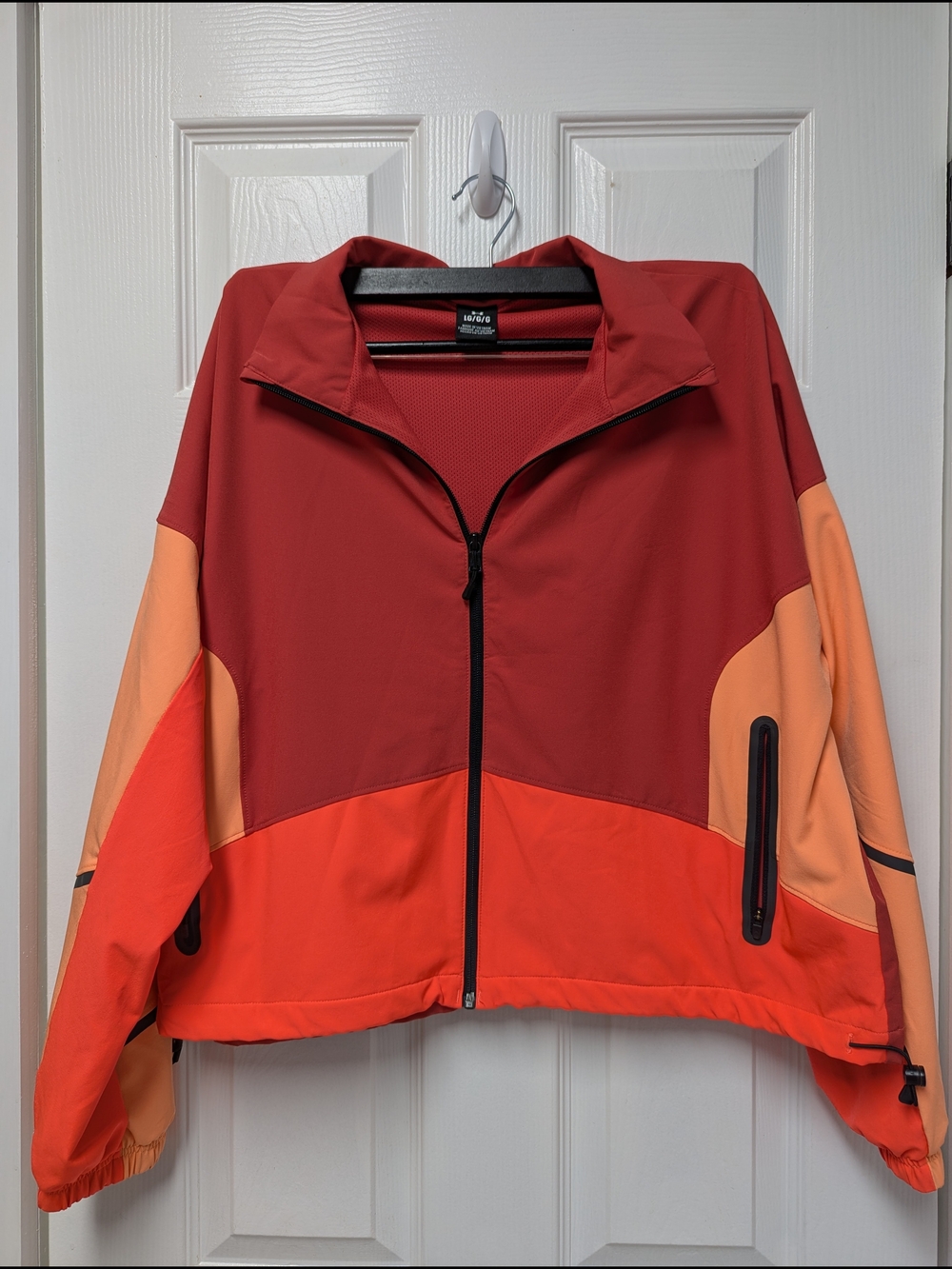 Under Armour Women’s Colorblock Zip-Up Jacket in Rust & Peach
